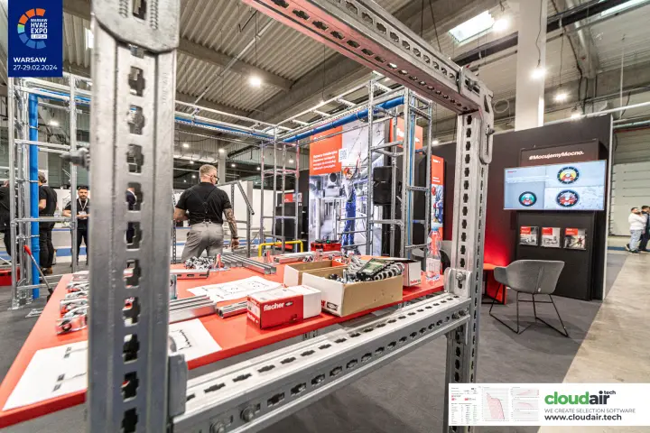 Fischer installation support frames and fixings on a red demo table at Warsaw HVAC Expo 2024