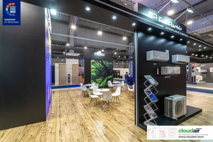 Fuji Electric display wall beside a Haier lounge with white chairs at Warsaw HVAC Expo 2024