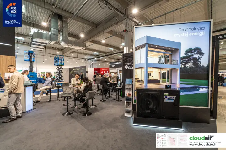 Gree Inverter heat pump in front of a backlit 'Technologia czystej energii' panel at Warsaw HVAC Expo 2024
