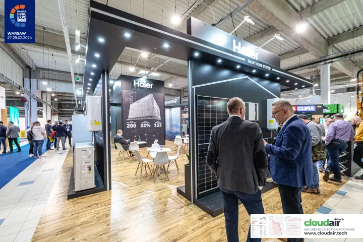 Haier stand lounge with solar panel display and 'NR 1' brand graphic at Warsaw HVAC Expo 2024