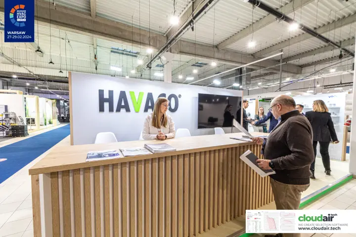 Havaco reception counter with wooden slats and white logo wall at Warsaw HVAC Expo 2024