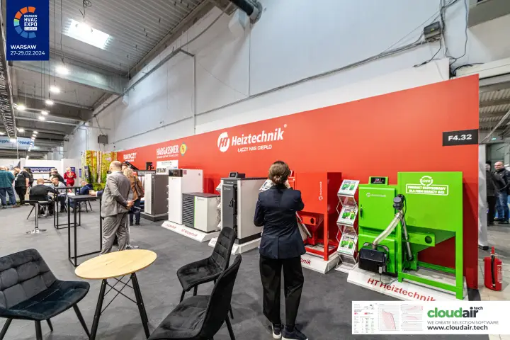 Heiztechnik red stand wall with pellet boilers, a heat pump and a green OZE boiler at Warsaw HVAC Expo 2024