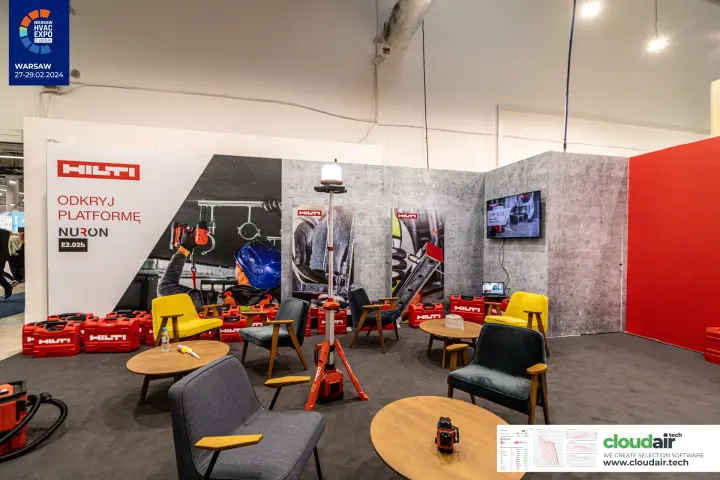 Hilti lounge with mid-century armchairs and NURON wall graphic at Warsaw HVAC Expo 2024