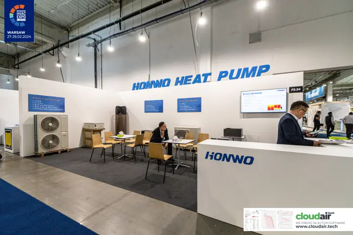 Honwo reception counter and meeting tables in front of heat pump displays