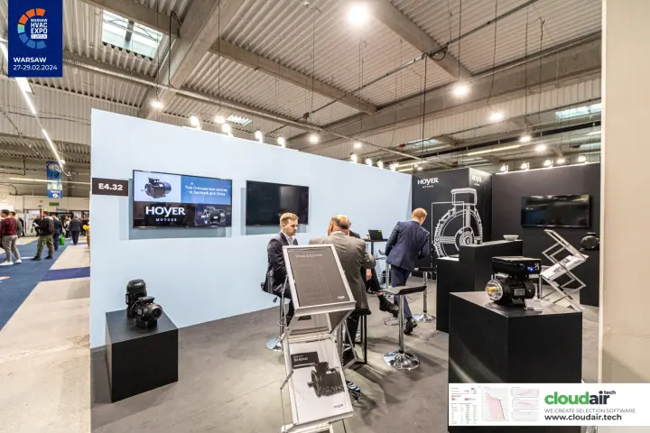 Hoyer Motors stand with IE4 motor brochures and meeting tables at Warsaw HVAC Expo 2024