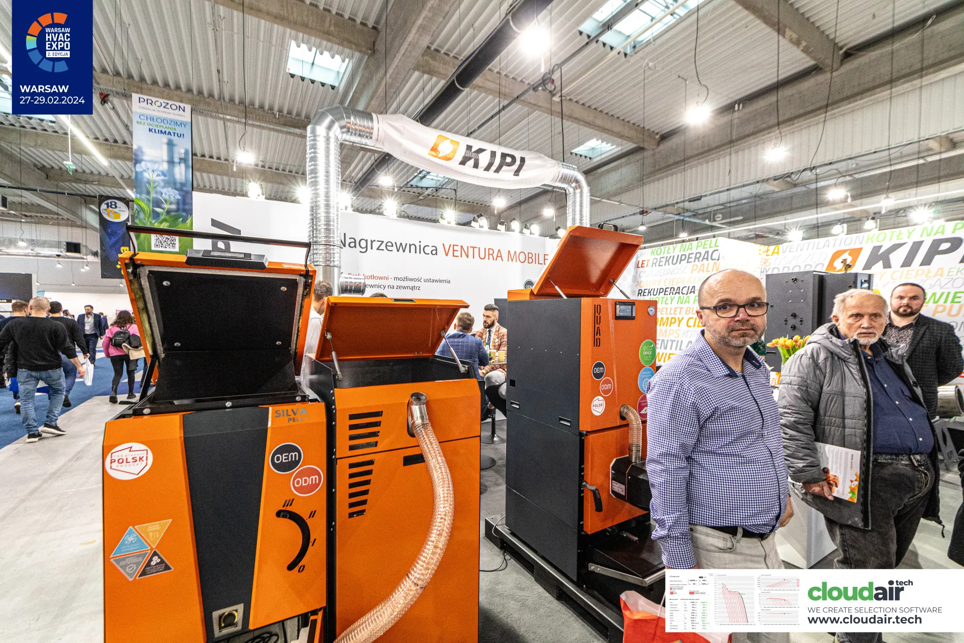 Kipi Silva and QUAD pellet boilers with open hoppers and a flexible fuel feed hose at Warsaw HVAC Expo 2024