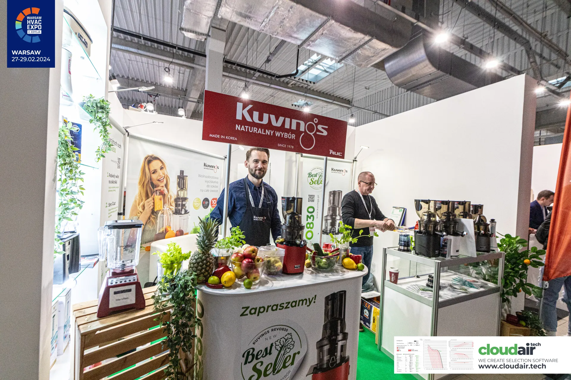Kuvings stand with slow juicers and fresh fruit on the counter at Warsaw HVAC Expo 2024
