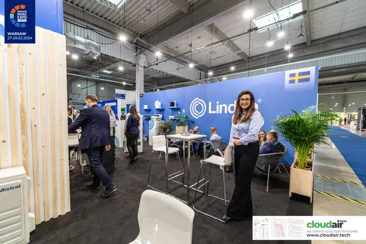 Lindab lounge area with diffuser shelves and a Swedish flag graphic at Warsaw HVAC Expo 2024