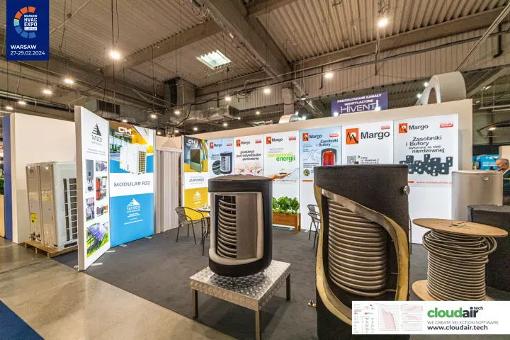 Margo cutaway storage tanks with stainless coils beside Tateco heat pump panels at Warsaw HVAC Expo 2024