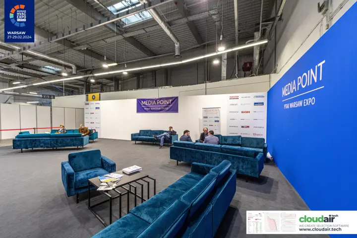 Media Point lounge with blue velvet sofas at Ptak Warsaw Expo