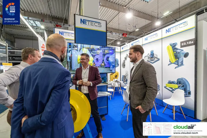 Netecs stand with a yellow fan impeller and industrial fan graphics at Warsaw HVAC Expo 2024