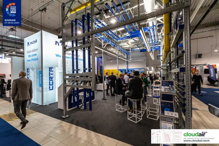 Niczuk stand framed by steel mounting rails carrying blue pipes at Warsaw HVAC Expo 2024