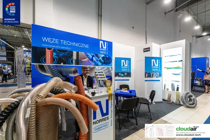 Norres stand with a pile of flexible spiral hoses and backlit sample showcase at Warsaw HVAC Expo 2024
