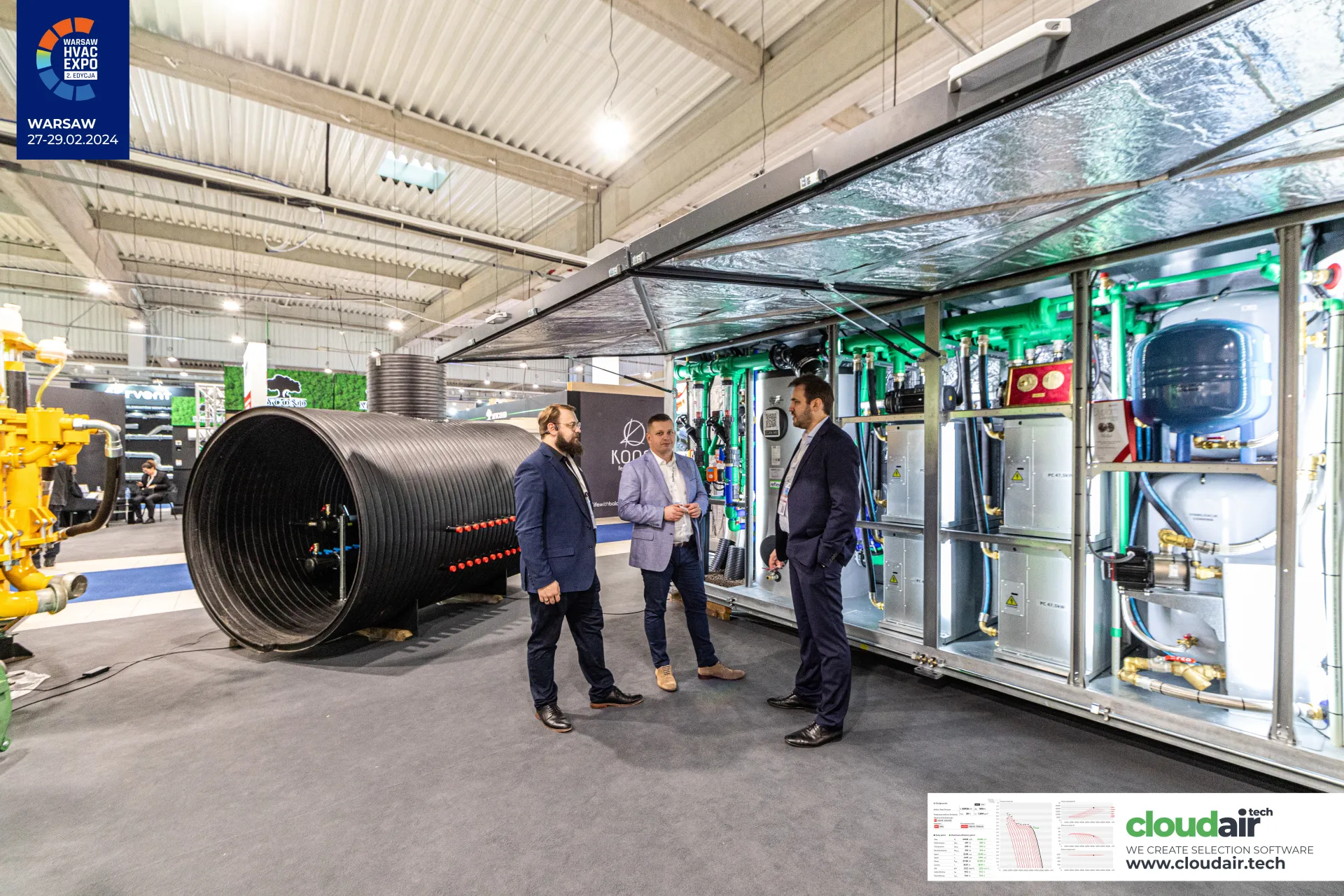 Open containerised plant room beside a black corrugated tank with manifolds at Warsaw HVAC Expo 2024