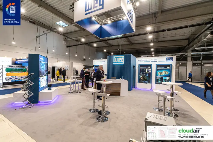 Open WEG island stand with suspended banner, counter and bar stools at Warsaw HVAC Expo 2024