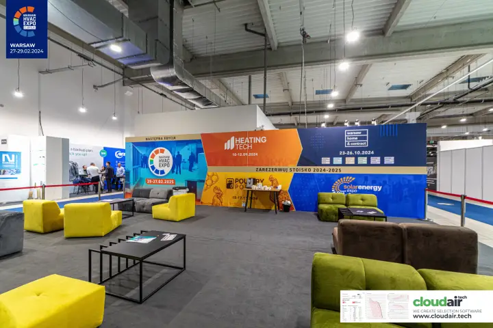 Organiser's lounge with a wall promoting Warsaw HVAC Expo 2025 and other fairs