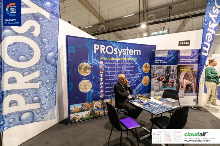 PROsystem backdrop with multilingual damp removal messages and roll-ups at Warsaw HVAC Expo 2024