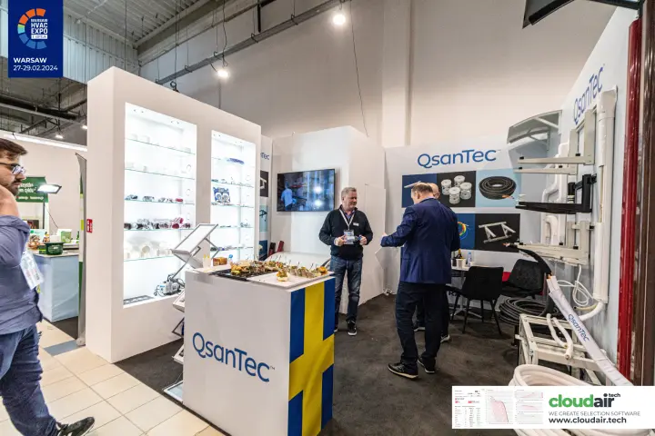 QsanTec stand with a Swedish-flag counter and lit display shelves