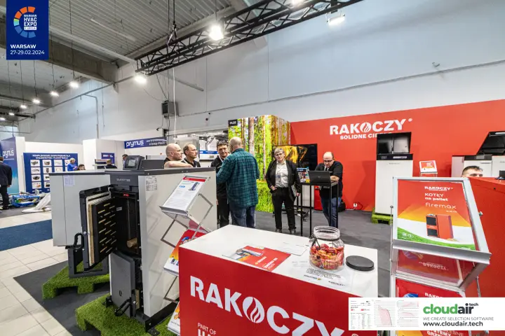 Rakoczy stand with a firemax pellet boiler poster and an open solid-fuel boiler
