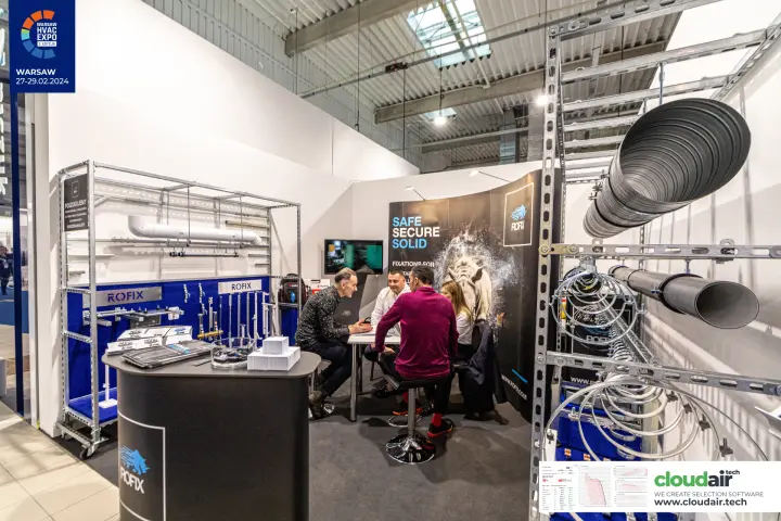 Rofix mounting racks with suspended ducts and clamps beside the counter at Warsaw HVAC Expo 2024
