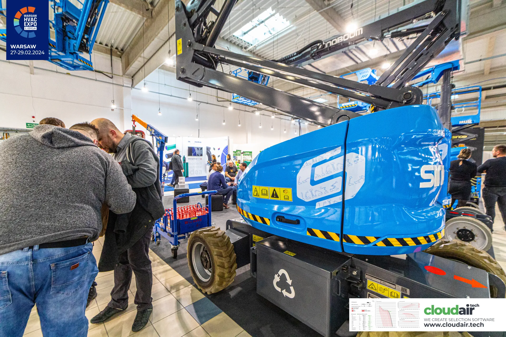 Sinoboom articulating boom lift close-up with blue rear hood at Warsaw HVAC Expo 2024