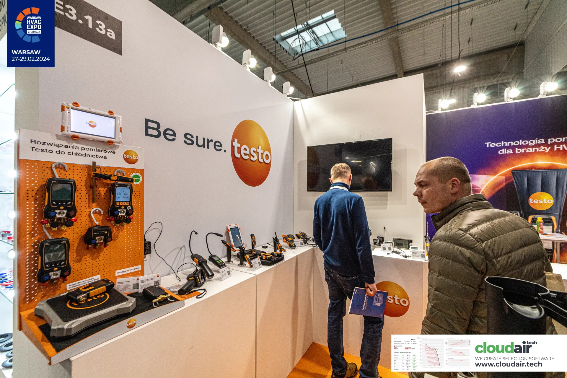 Testo refrigeration manifolds and refrigerant scale on orange pegboard at Warsaw HVAC Expo 2024