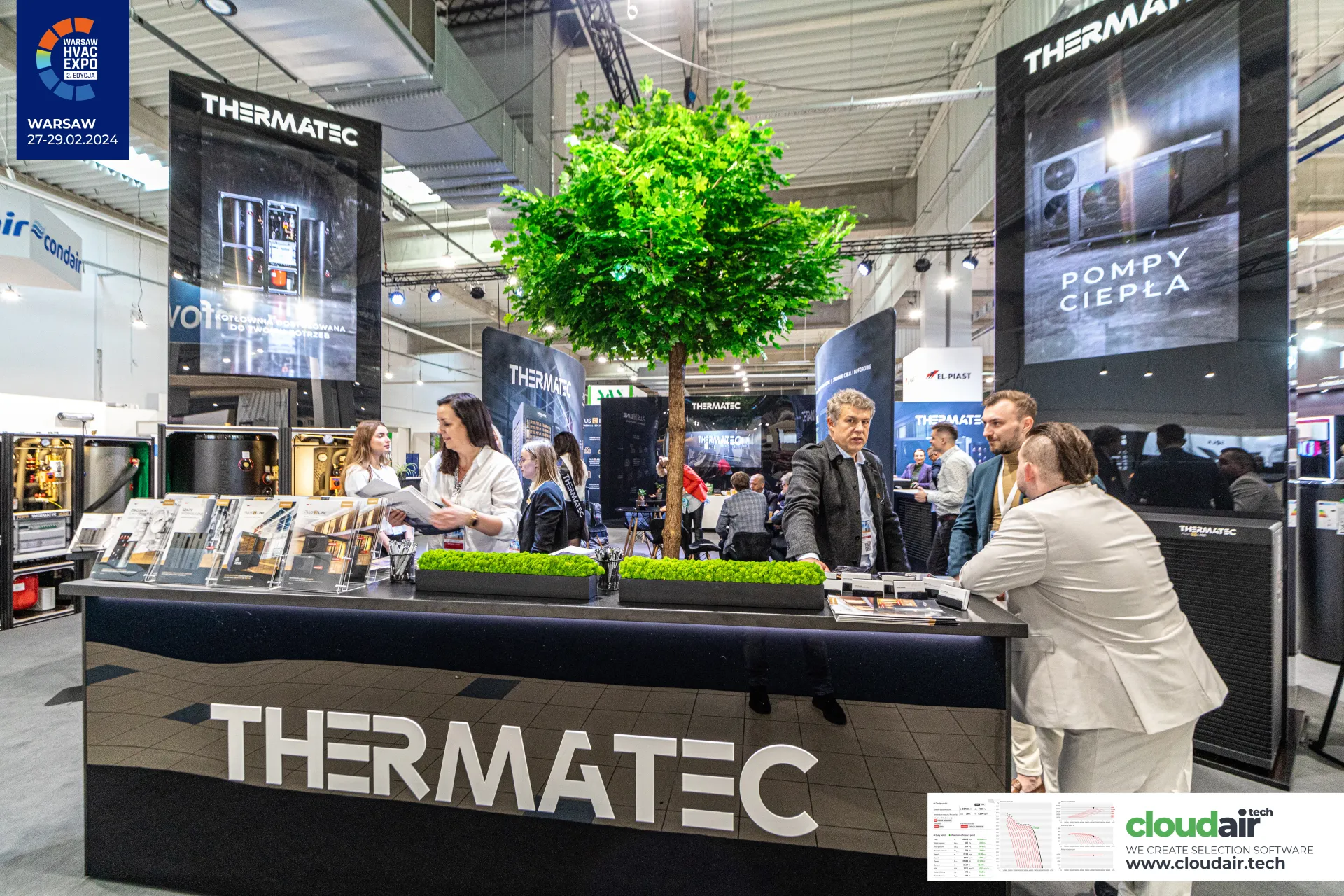 Thermatec counter beneath a 'POMPY CIEPŁA' display tower and tree at Warsaw HVAC Expo 2024