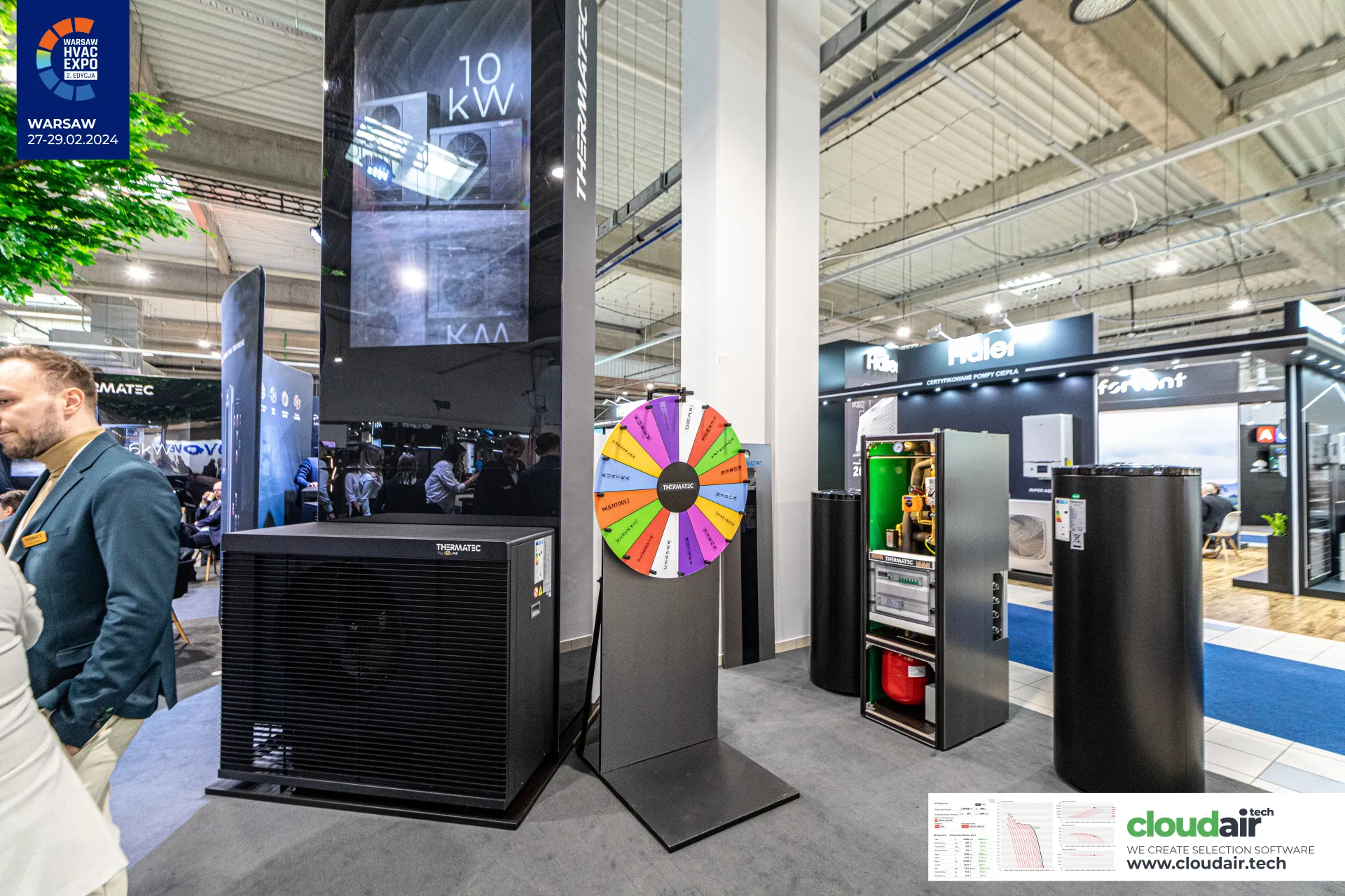 Thermatec heat pump, open hydraulic cabinet and storage tanks with prize wheel at Warsaw HVAC Expo 2024