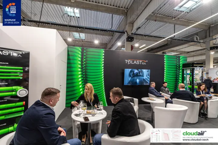 Tplast meeting lounge beside a board of green ventilation ducts