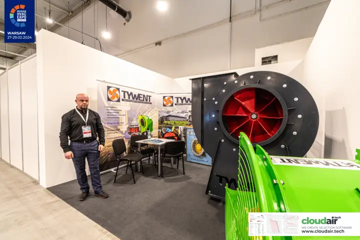 Tywent centrifugal fan with red impeller beside company roll-ups
