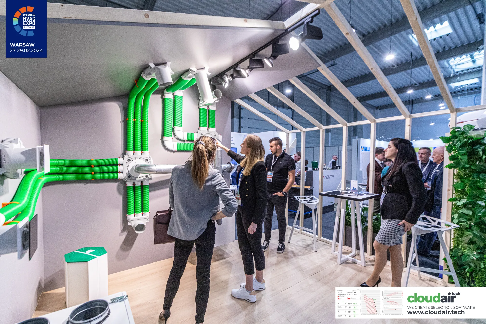 Vents demo wall of green flexible ducts and distribution boxes at Warsaw HVAC Expo 2024