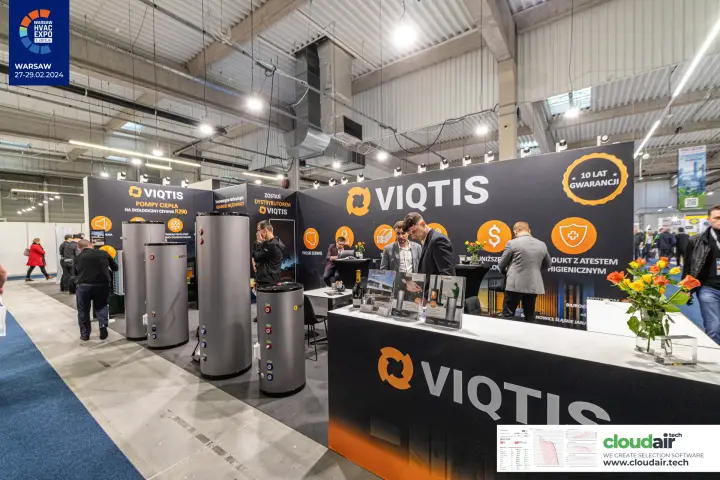 Viqtis stand with hot water cylinders and orange-on-black branding