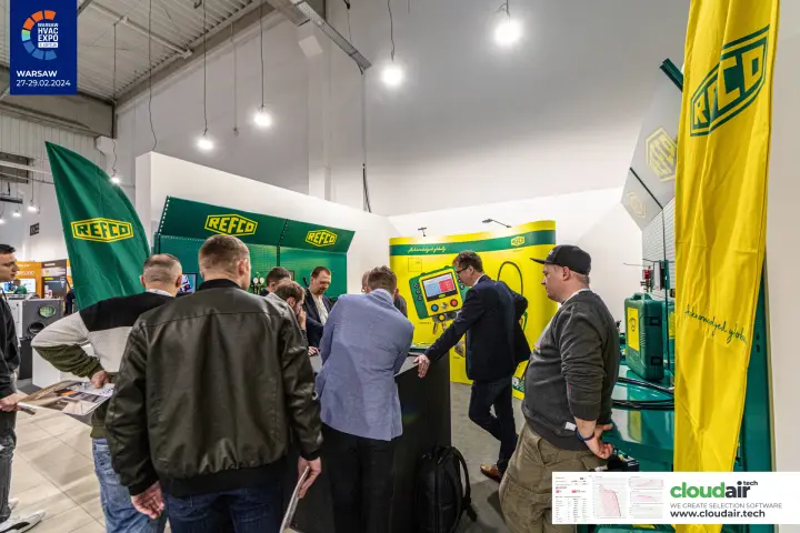 Visitors crowd the Refco counter in front of a digital manifold backdrop at Warsaw HVAC Expo 2024