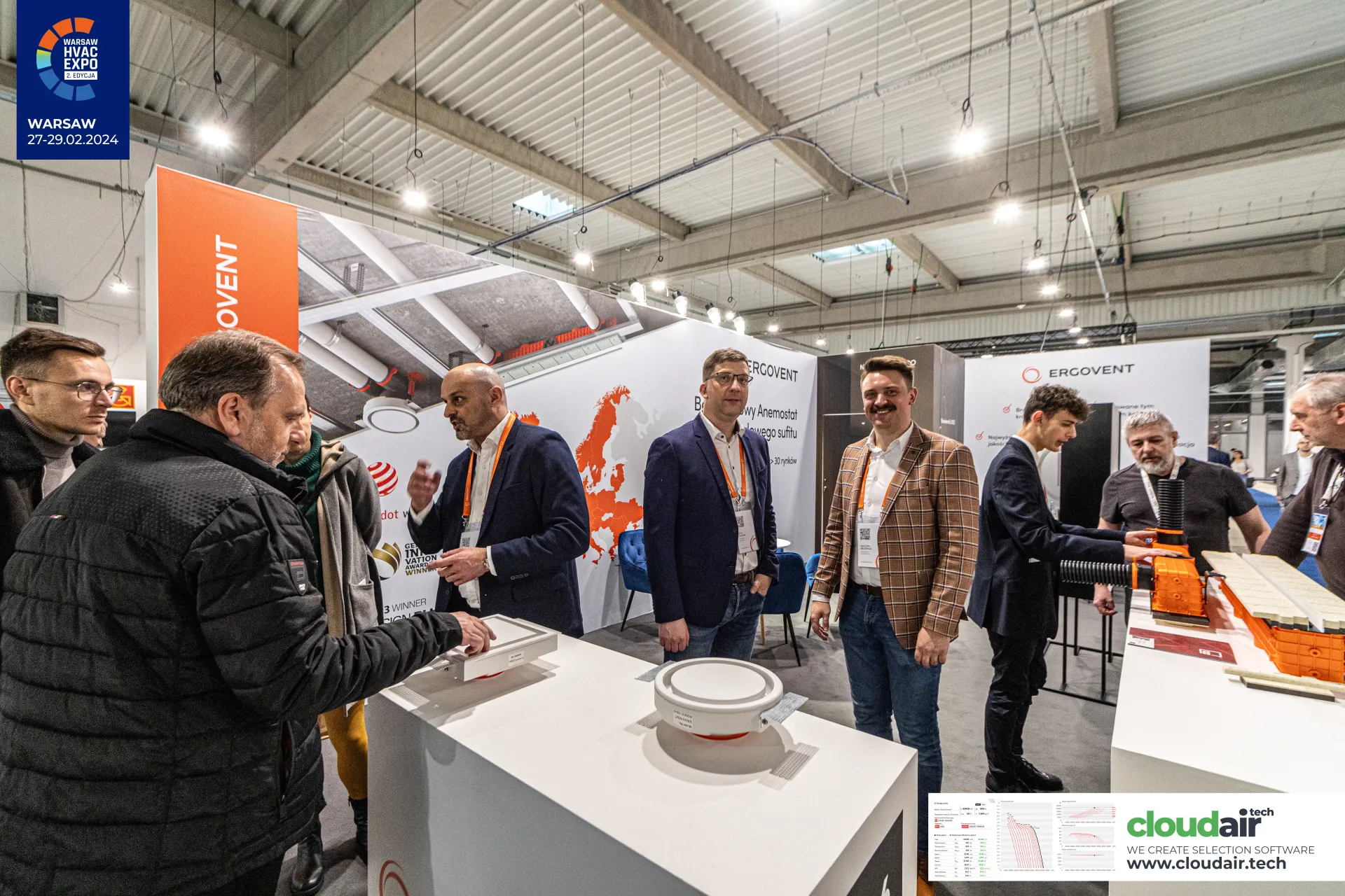 Visitors inspecting round and square Ergovent ceiling diffusers at Warsaw HVAC Expo 2024