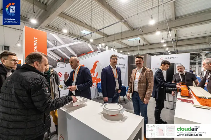 Visitors inspecting round and square Ergovent ceiling diffusers