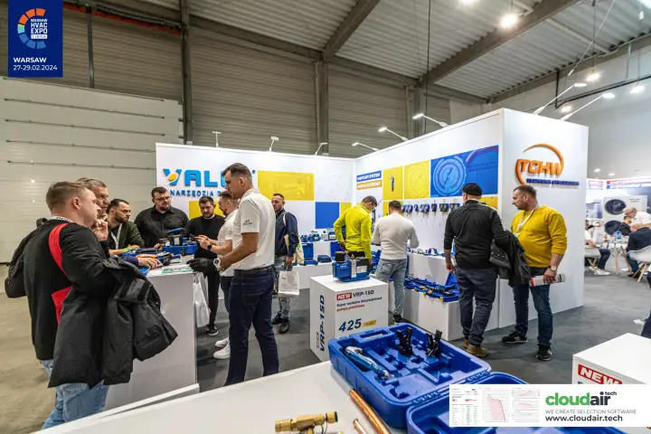 Visitors try Value service tools beside the new VRP-15D two-stage vacuum pump at Warsaw HVAC Expo 2024