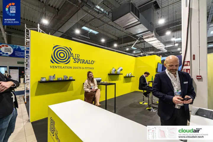 Yellow Air Spiralo back wall with logo, elbows and duct couplers at Warsaw HVAC Expo 2024