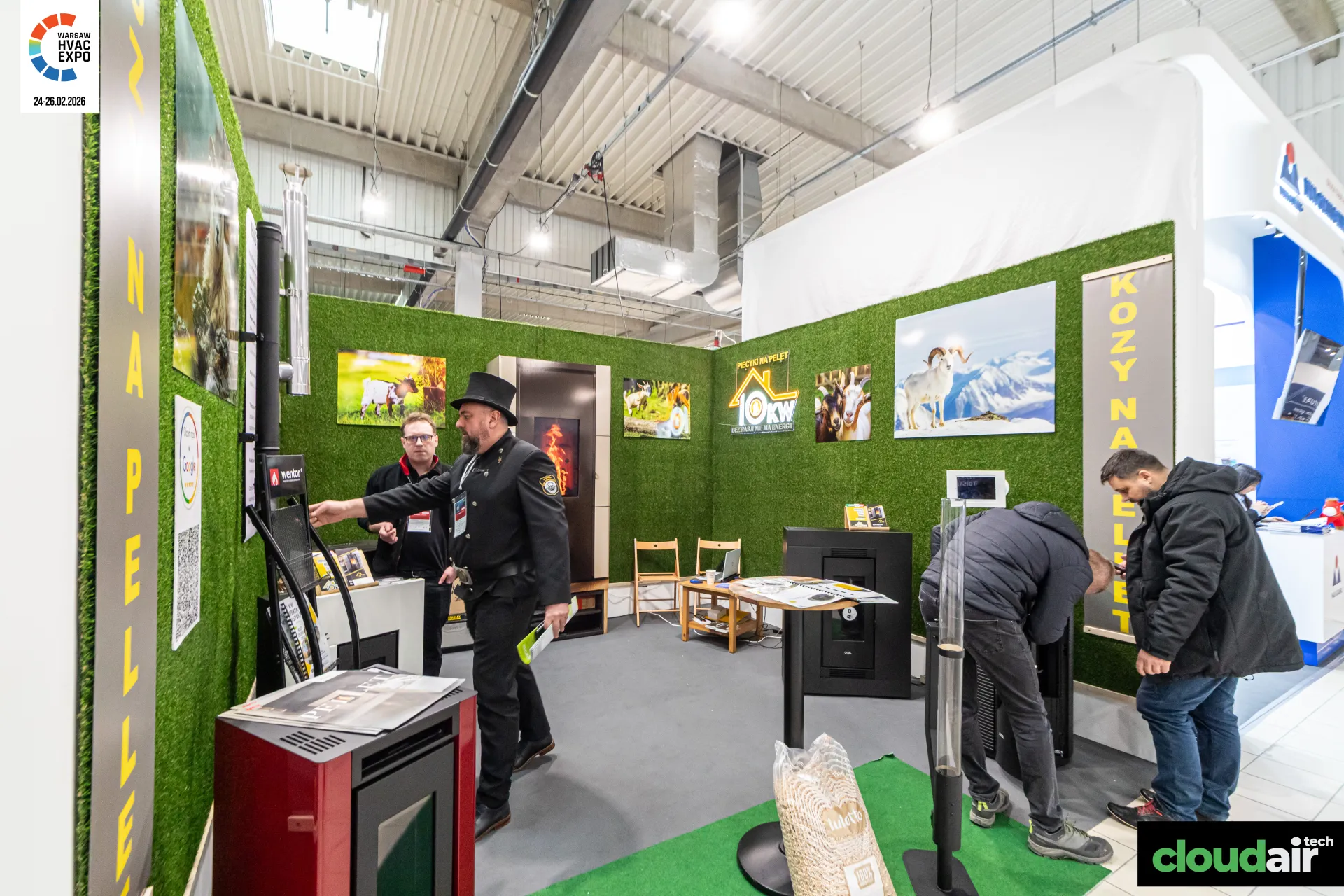 10KW pellet stove stand with artificial grass walls and goat photographs at Warsaw HVAC Expo 2026