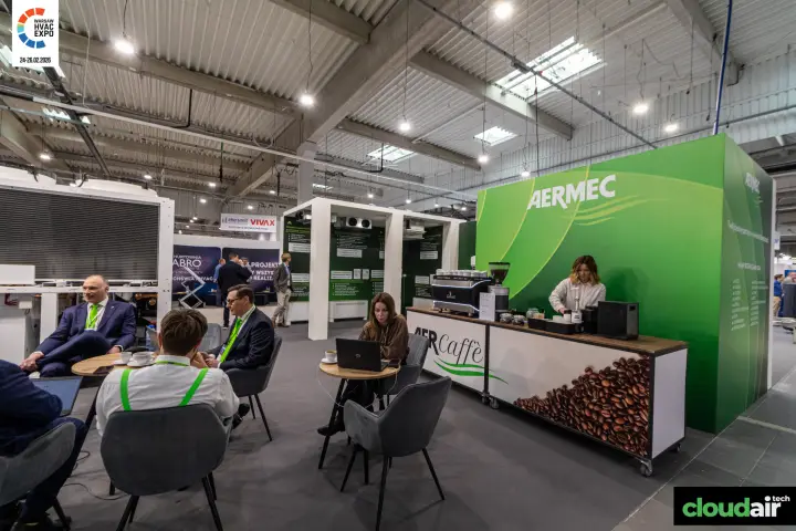 Aermec AERCaffè coffee bar and lounge area beside a green branded wall at Warsaw HVAC Expo 2026