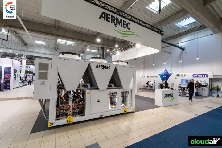 Aermec air-cooled unit with exposed compressors below a suspended logo at Warsaw HVAC Expo 2026