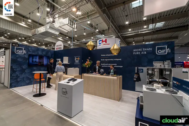 Airfi stand with heat recovery units on a navy forest-pattern backdrop at Warsaw HVAC Expo 2026