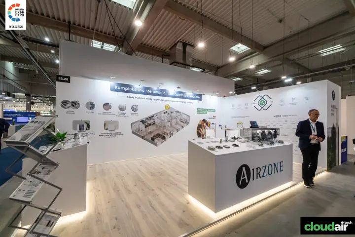 Airzone stand with zoning thermostats and a duct plenum on the counter at Warsaw HVAC Expo 2026