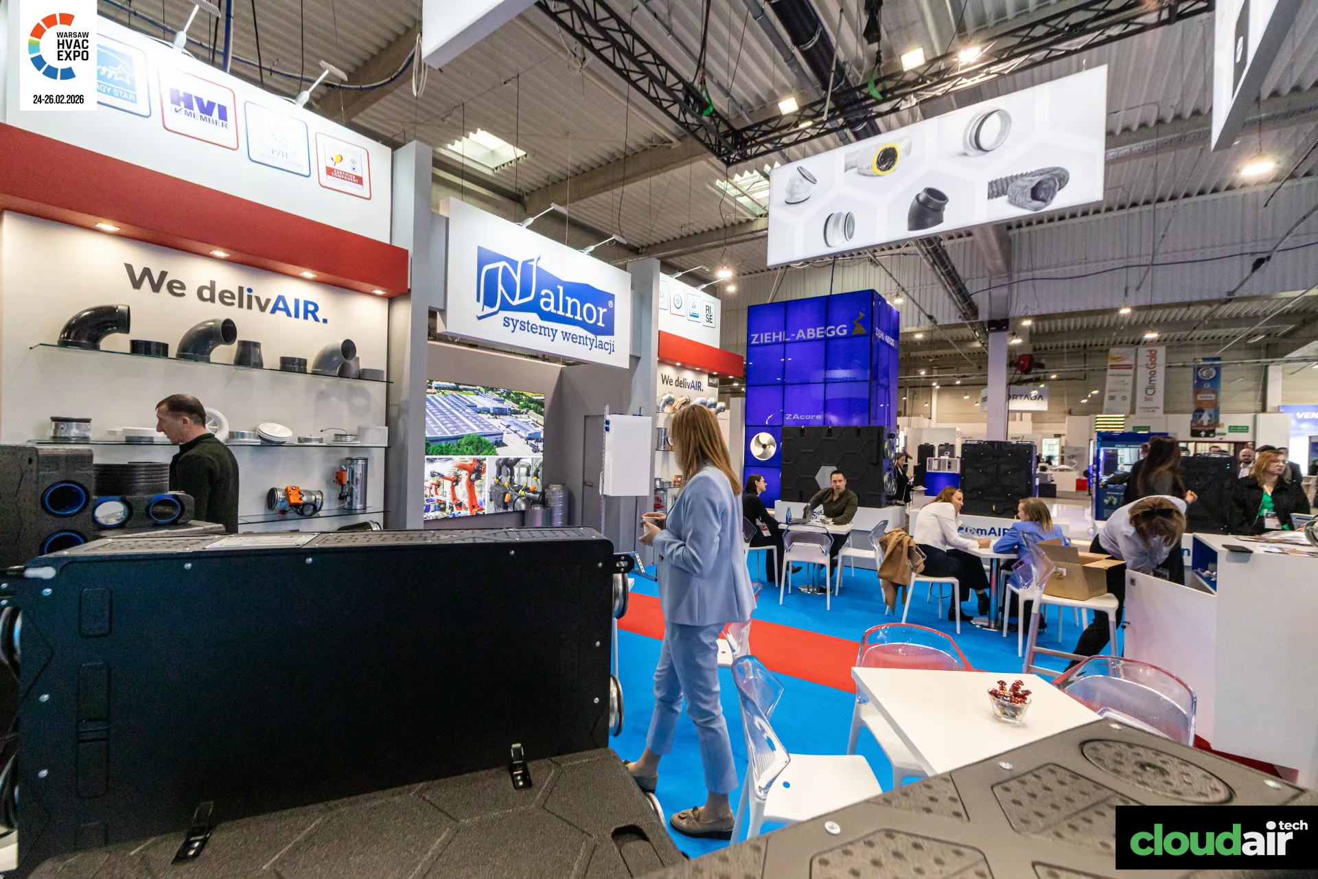 Alnor stand interior with fitting shelves and a lounge under the Ziehl-Abegg tower at Warsaw HVAC Expo 2026