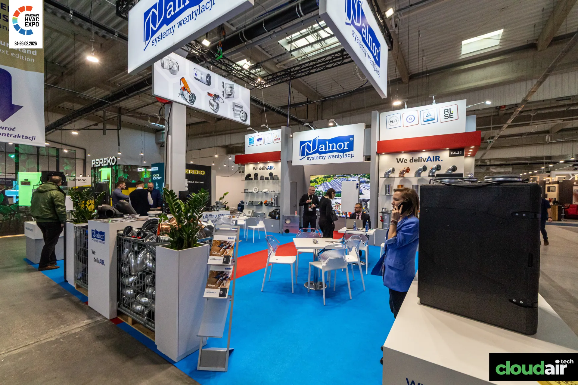 Alnor stand with suspended signs, duct fitting cages and a black ventilation unit at Warsaw HVAC Expo 2026