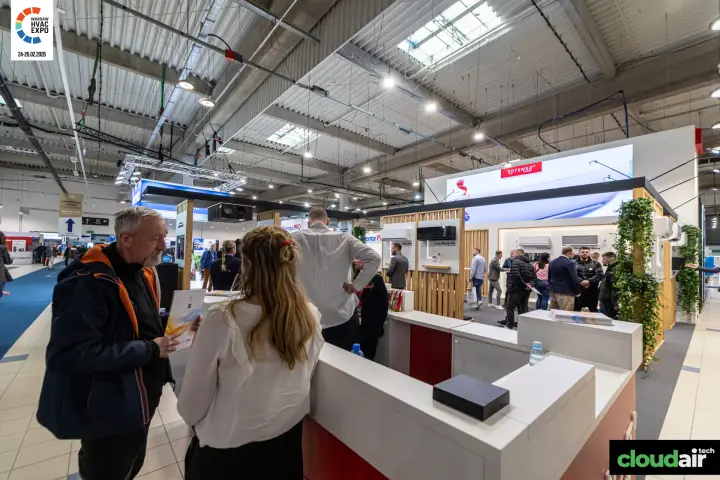 Busy Rotenso stand with wall-mounted air conditioners and green walls