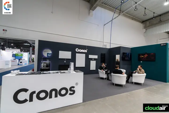 Cronos stand with wall-mounted panel heaters and white lounge armchairs at Warsaw HVAC Expo 2026