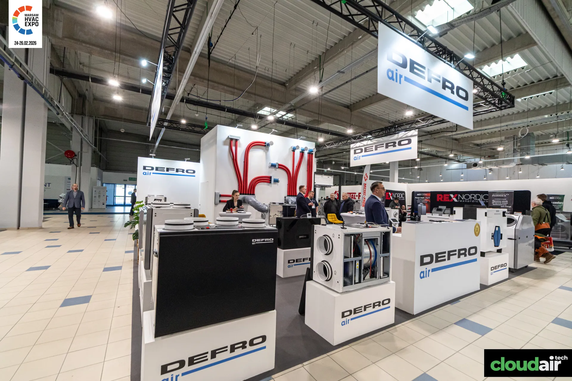 Defro Air heat recovery units and red flexible duct wall at Warsaw HVAC Expo 2026