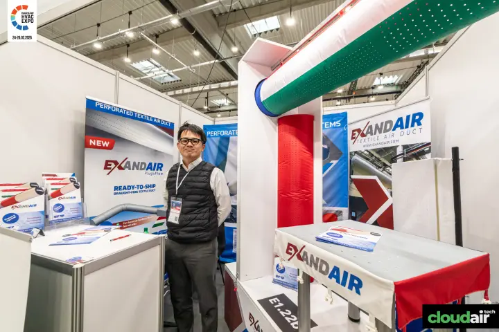 Exandair booth with red and green perforated textile air ducts