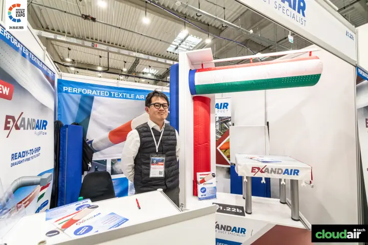 Exandair booth with a red, white and green fabric duct on a white frame