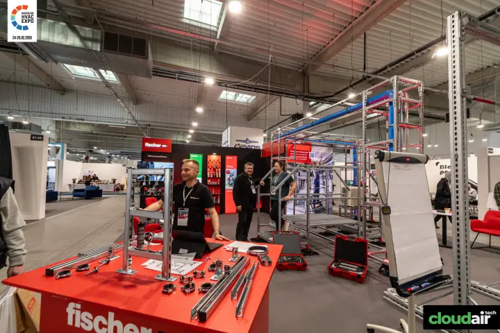 Fischer demo table with strut channels, pipe clamps and red system cases at Warsaw HVAC Expo 2026